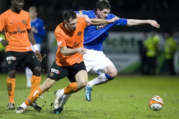 Rangers Kyle Lafferty Stands Strong Against Mihael Kovacevic in Intense Scottish FA Cup Clash: Dundee United vs Rangers (1-0)