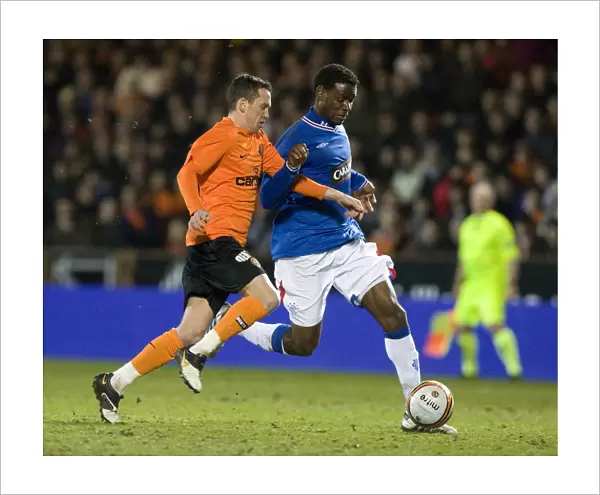 Rangers Mo Edu Fends Off Dundee United's David Robertson in Scottish FA Cup Sixth Round Replay