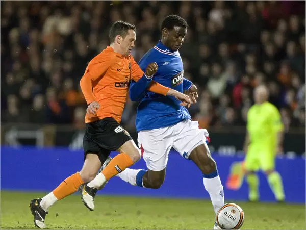 Rangers Mo Edu Fends Off Dundee United's David Robertson in Scottish FA Cup Sixth Round Replay