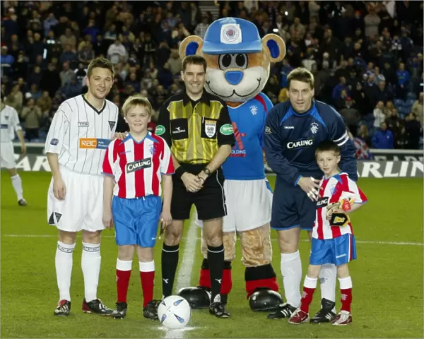 Rangers Triumph: Celebrating a 4-1 Victory over Dunfermline with Their Mascot (23 / 03 / 04)