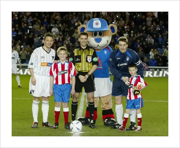 Rangers Triumph: Celebrating a 4-1 Victory over Dunfermline with Their Mascot (23 / 03 / 04)