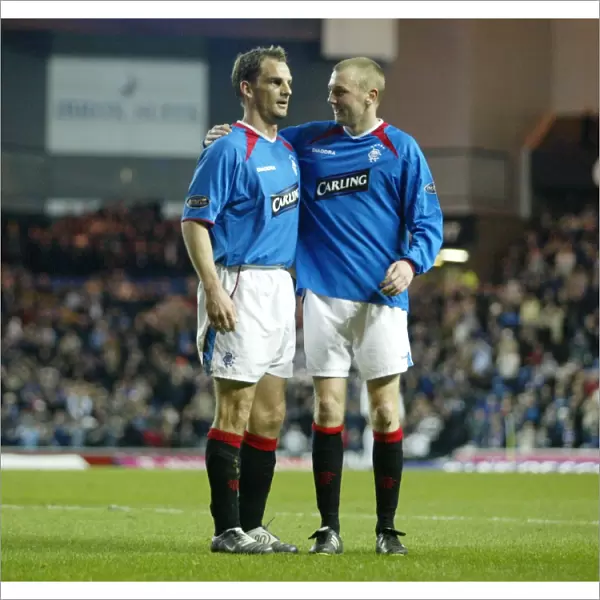 Rangers Ronald de Boer and Stephen Hughes: Celebrating a 4-1 Victory over Dunfermline (23 / 03 / 04)