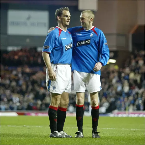 Rangers Ronald de Boer and Stephen Hughes: Celebrating a 4-1 Victory over Dunfermline (23 / 03 / 04)