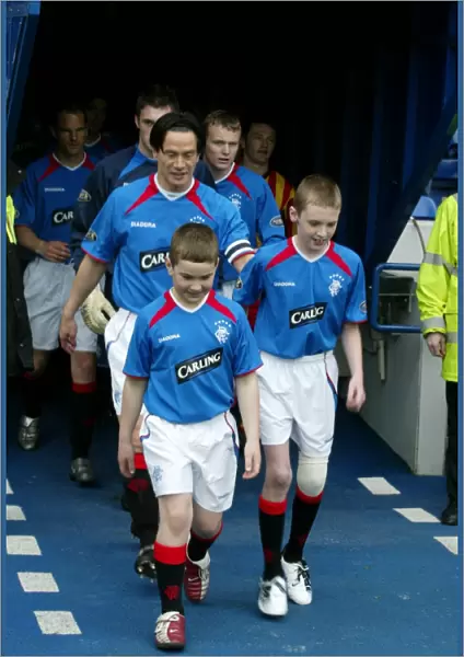 Rangers Football Club: Michael Mols and Mascots Celebrate Victory over Partick Thistle (April 17, 2004)