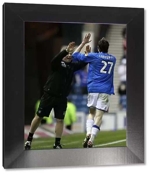 Rangers Kyle Lafferty and Ally McCoist: A Jubilant Moment at Ibrox After Lafferty's Goal vs Aberdeen (3-1)