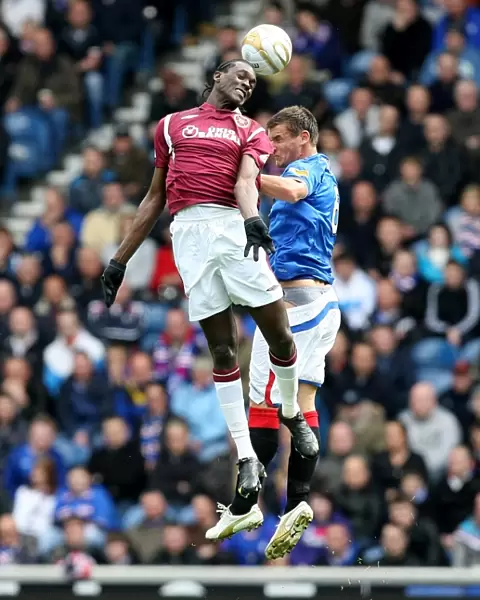 Intense Aerial Clash: McCulloch vs Obua - Rangers 2-0 Victory Over Heart of Midlothian