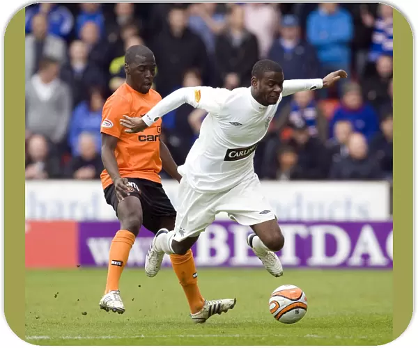 Rangers Maurice Edu Foul by Morgaro Gomis in Intense Clydesdale Bank Scottish Premier League Clash: Rangers 2-1 Dundee United