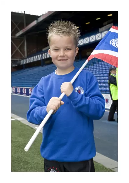 Rangers Football Club: SPL Champions Greeted by Thrilled Kids during Motherwell Match (SPL Champions Parade)