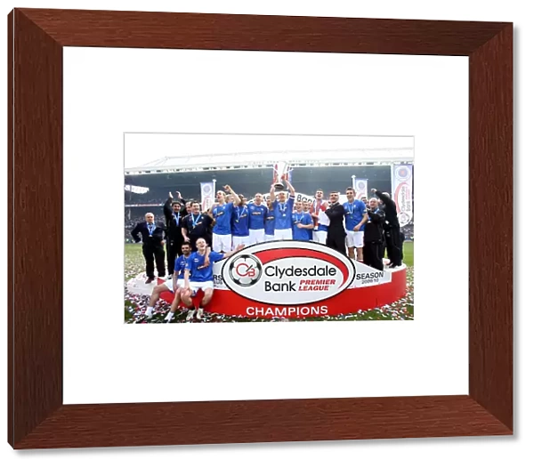 Rangers Football Club: Triumphant Moment - Captain David Weir Lifts the SPL Trophy at Ibrox Stadium
