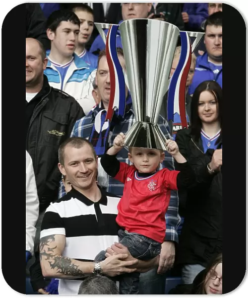 Rangers FC: SPL Champions - Triumphant Moment with the Trophy at Ibrox Stadium among Ecstatic Fans