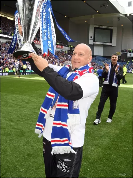 Rangers Football Club: SPL Champions 2023 - Kenny McDowall's Triumphant Moment with the Trophy at Ibrox Stadium