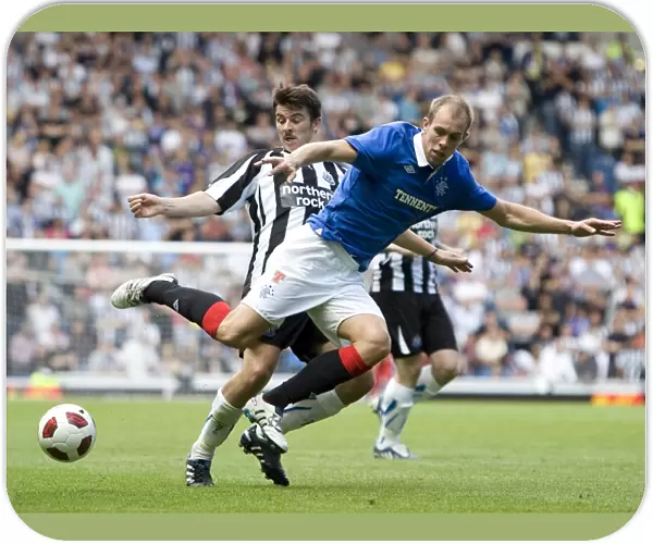 Whittaker Fouled by Barton: Rangers Pre-Season Victory Over Newcastle United (2-1)
