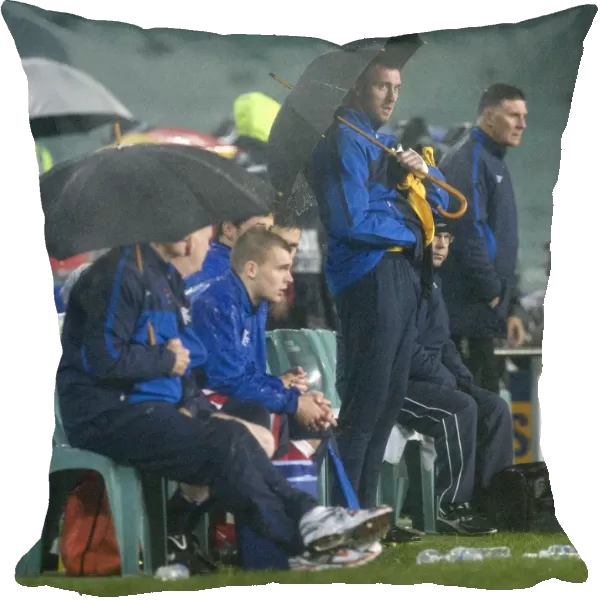 Rangers FC's Alan McGregor Shields the Bench with an Umbrella during Sydney Festival of Football 2010