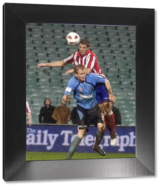 Rangers Andy Little Soars Over Sydney FC's Hayden Foxe: A Leap of Faith at the Sydney Festival of Football 2010