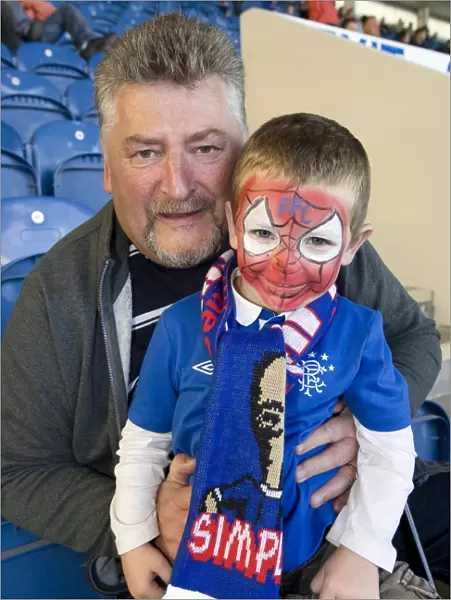 Rangers Andy Gilmour and Grandson Lewis Henges: A Heartwarming Moment of Celebration Amidst Rangers 4-0 Victory over Dundee United (Clydesdale Bank Scottish Premier League)