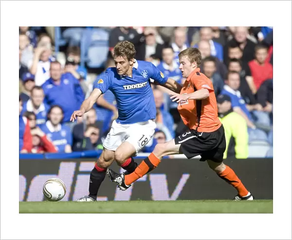 Intense Battle at Ibrox: Jelavic vs Dixon - Rangers 4-0 Victory Over Dundee United