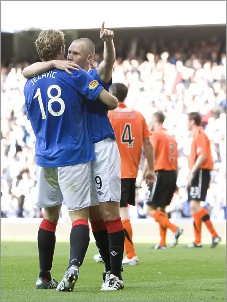 Rangers Double Trouble: Miller and Jelavic Celebrate Four-Goal Lead Over Dundee United at Ibrox