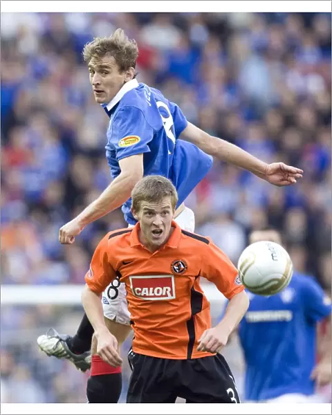 Rangers Jelavic Scores Spectacular Goal Against Dundee United's Dixon in 4-0 Ibrox Victory