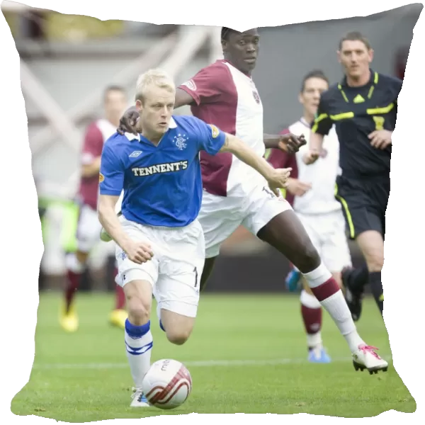 Naismith vs Obua: A Pivotal Moment in the Clydesdale Bank Scottish Premier League Match at Tynecastle (1-2 in Favor of Rangers)