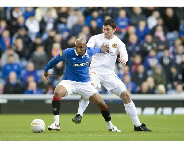Rangers El Hadji Diouf vs John Sutton: A Moment from Rangers 6-0 Victory in the Scottish Premier League at Ibrox Stadium