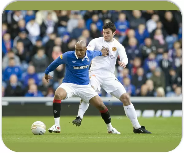 Rangers El Hadji Diouf vs John Sutton: A Moment from Rangers 6-0 Victory in the Scottish Premier League at Ibrox Stadium