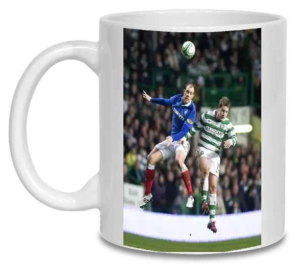 Steven Whittaker vs Kris Commons: A Riveting Rivalry - Rangers vs Celtic's Scottish Cup Fifth Round Replay Clash at Celtic Park (1-0 in Favor of Celtic)