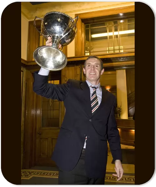 David Weir's Triumphant Return with the Co-operative Cup: Rangers Captain Celebrates Victory at Ibrox Stadium