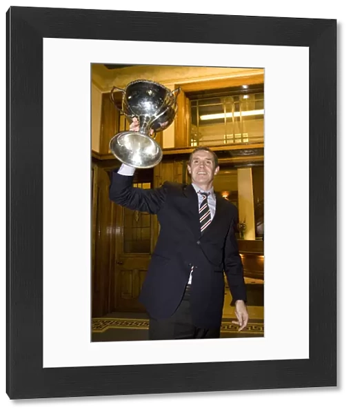 David Weir's Triumphant Return with the Co-operative Cup: Rangers Captain Celebrates Victory at Ibrox Stadium
