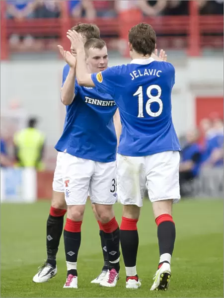 Rangers Nikica Jelavic Scores First Goal Against Hamilton Academical in Scottish Premier League: Celebration with Team Mates (18-1)