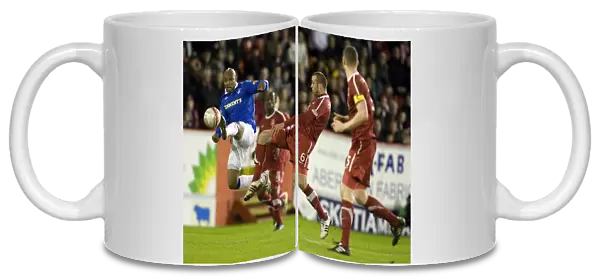 Diouf Scores the Opener: Rangers vs. Aberdeen at Pittodrie Stadium (Clydesdale Bank Scottish Premier League)