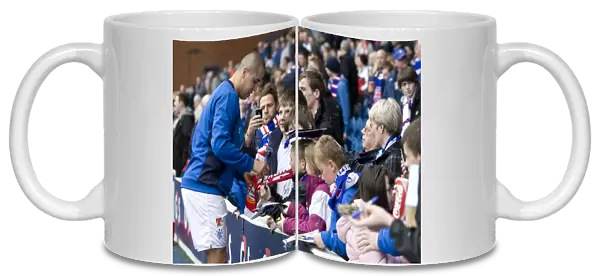 Rangers Madjid Bougherra: Granting Wishes Amidst the Thrill of a 2-1 Victory over St Mirren at Ibrox Stadium - Autograph Signing Session