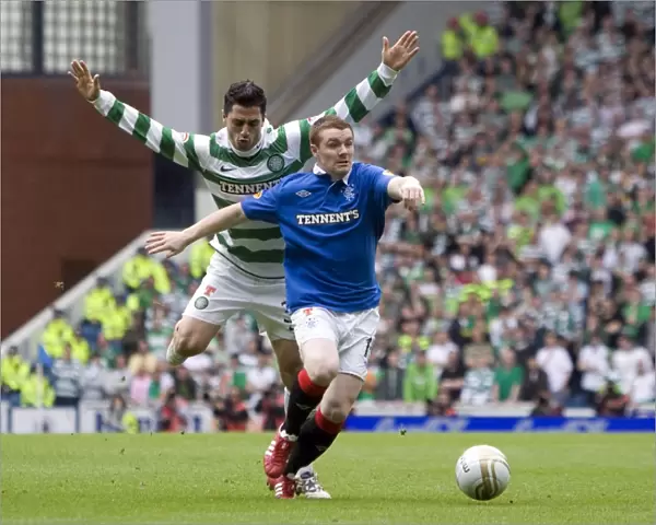 Intense Rivalry: John Fleck vs Beram Kayal's Battle for Ball Possession in Rangers vs Celtic (0-0) Clydesdale Bank Scottish Premier League