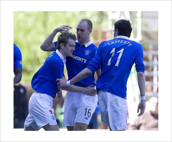 Rangers Triumphant Three: Davis, Whittaker, and Lafferty Celebrate Goals in Motherwell's Fir Park (5-0 Scottish Premier League Victory)