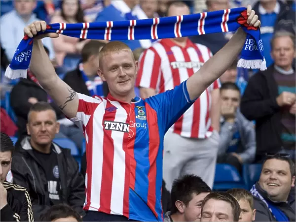 Unified Rangers Fans Celebrate 4-0 Victory Over Hearts: A Sea of Rangers-Caley Thistle Stripes at Ibrox