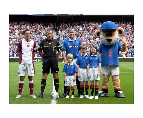 Rangers Football Club: Celebrating a 4-0 Victory over Hearts at Ibrox Stadium - Mascots Rejoice in Clydesdale Bank Scottish Premier League Triumph