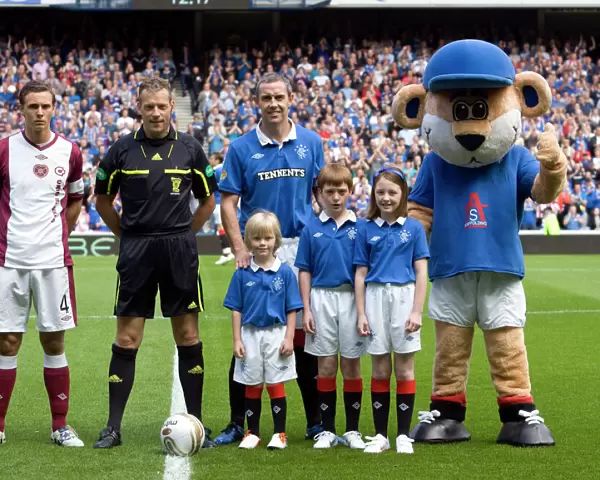 Rangers Football Club: Celebrating a 4-0 Victory over Hearts at Ibrox Stadium - Mascots Rejoice in Clydesdale Bank Scottish Premier League Triumph