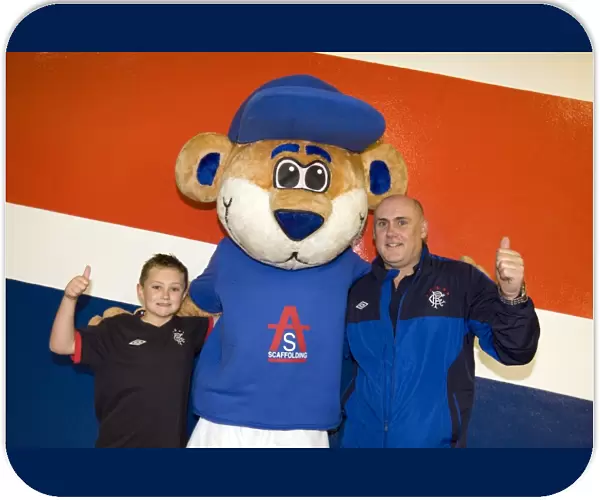 A Family Affair: Rangers Triumphant 4-0 Victory over Heart of Midlothian at Ibrox Stadium - Family Fun in the Broomloan Stand