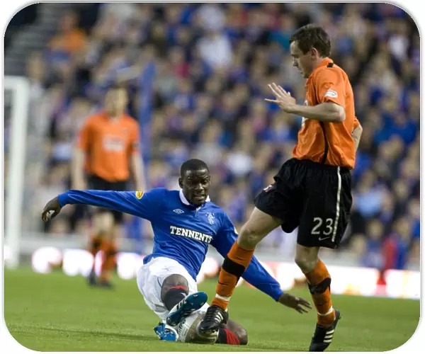 Rangers vs Dundee United: Maurice Edu Tackles Keith Watson - Ibrox Stadium, Clydesdale Bank Scottish Premier League - Rangers Lead 2-0