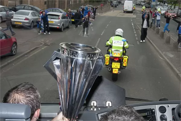 Champions Triumph: Rangers Football Club Welcomes Home the SPL Trophy