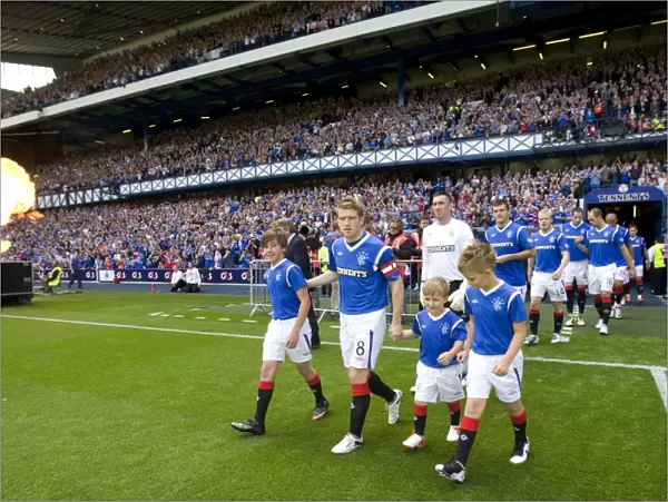 Steven Davis and the Mascots: Leading Rangers and Heart of Midlothian onto Ibrox Stadium's Field (1-1 Clydesdale Bank Scottish Premier League)