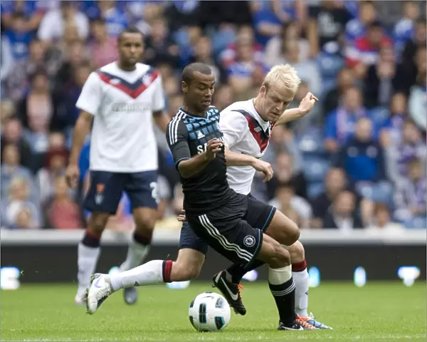 Intense Rivalry: Naismith vs. Cole's Battle for the Ball - Rangers vs. Chelsea at Ibrox (3-1 in Favor of Chelsea)