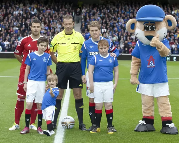 Rangers Football Club: Triumphant Moment with Mascots Celebrating 2-0 Win over Aberdeen at Ibrox
