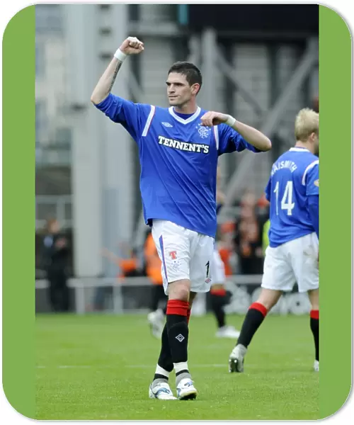 Rangers Kyle Lafferty: Triumphant Celebration at Tannadice Stadium after Securing a 1-0 Victory for Rangers in the Scottish Premier League