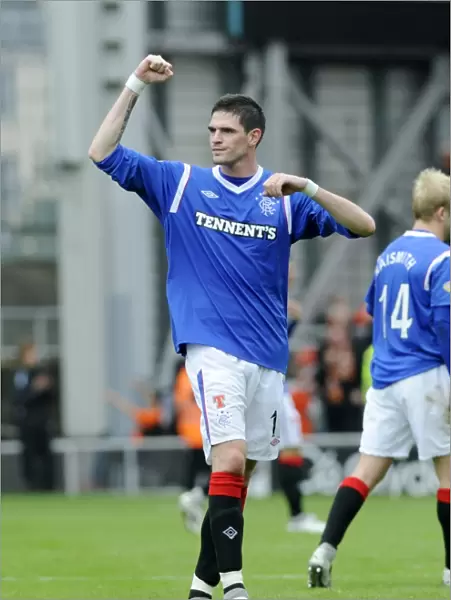 Rangers Kyle Lafferty: Triumphant Celebration at Tannadice Stadium after Securing a 1-0 Victory for Rangers in the Scottish Premier League