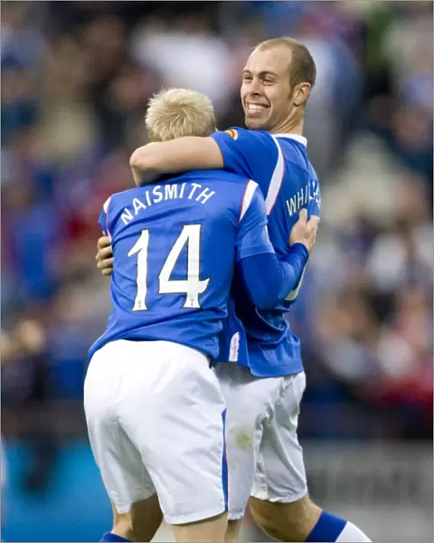Rangers Naismith and Whittaker: A Dynamic Duo Celebrates a 2-0 Goal Against Hearts at Tynecastle Stadium