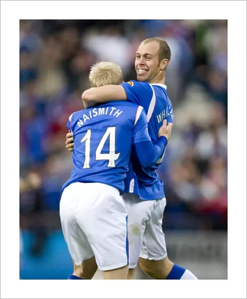 Rangers Naismith and Whittaker: A Dynamic Duo Celebrates a 2-0 Goal Against Hearts at Tynecastle Stadium