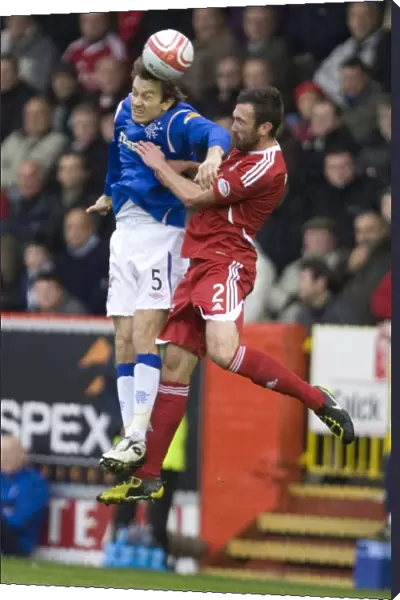 Intense Clash: Papac vs McArdle in Aberdeen vs Rangers 2-1 Clydesdale Bank Scottish Premier League Battle at Pittodrie Stadium