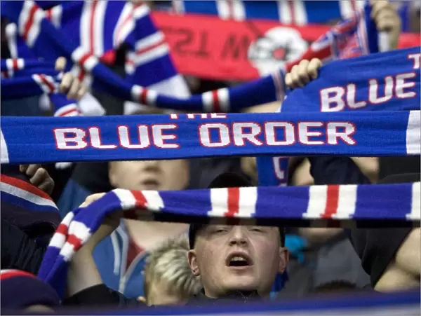 Triumphant Rangers Blue Order: Celebrating a 3-0 Victory at Ibrox Stadium