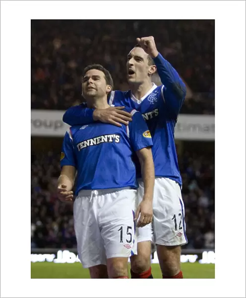Triumphant Rangers: Healy and Wallace Celebrate Historic 3-0 Victory over Motherwell at Ibrox Stadium