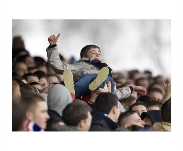 Young Rangers Fan Excitely Surfs the Crowd Amidst the Thrills of a 4-0 Scottish Cup Victory over Arbroath at Gayfield Park